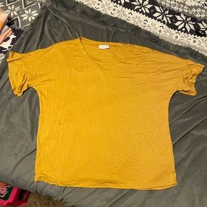 Yellow short sleeve shirt with ruffle detail